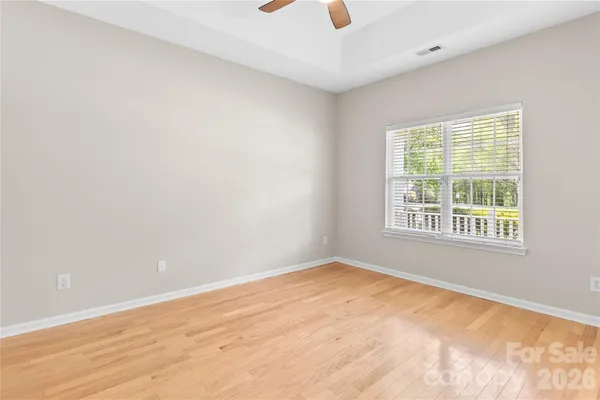 an empty room with wooden floor