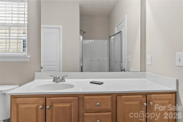 a bathroom with a sink a toilet and bathtub
