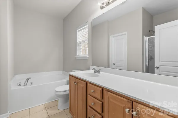 a white bath tub sitting next to a white sink