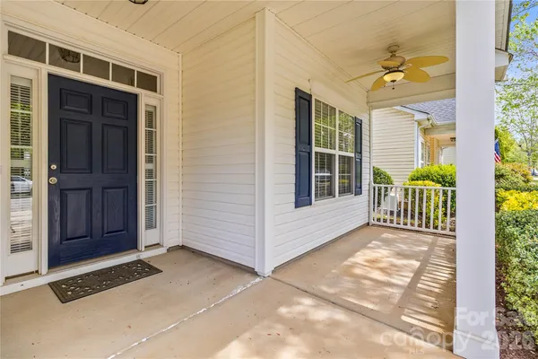 a view of a house with a door and wooden floor