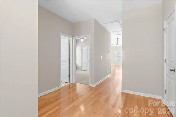 a living room with furniture a fireplace and a large window