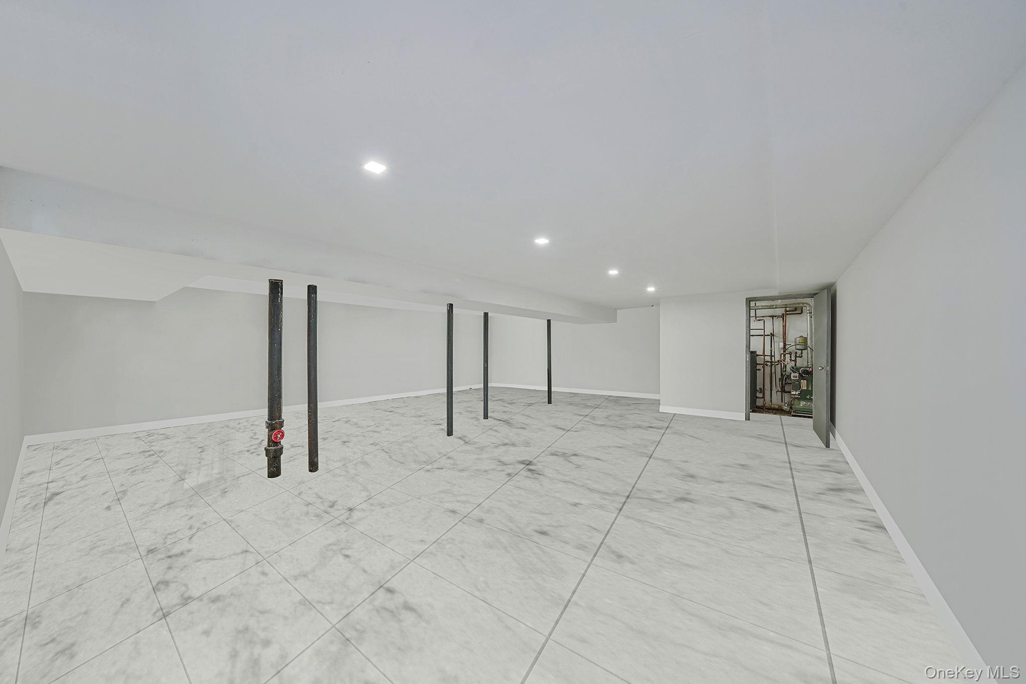 202-02 109th Avenue Queens, NY 11412 - Photo 23 of 26 Finished below grade area featuring recessed lighting and baseboards