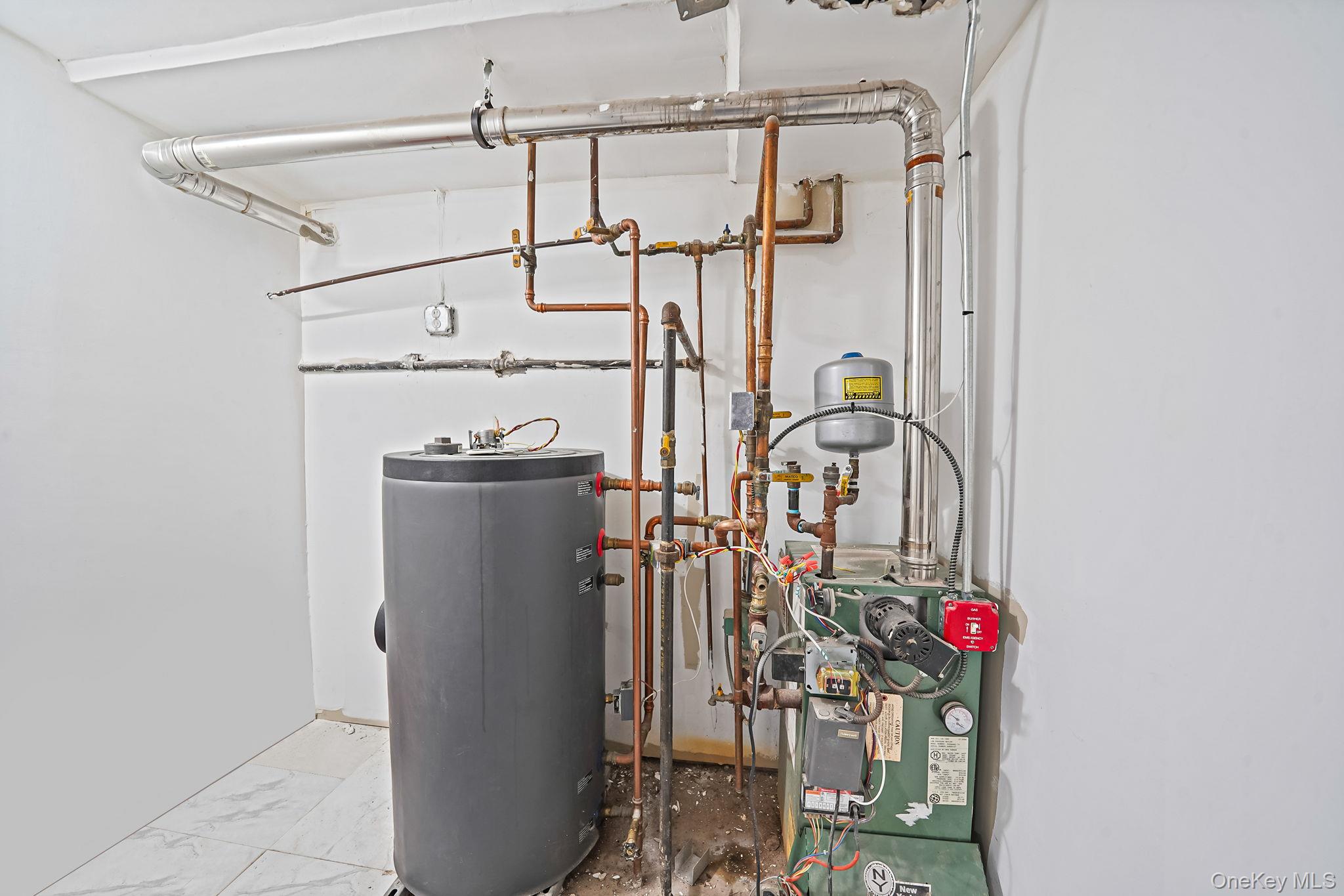 202-02 109th Avenue Queens, NY 11412 - Photo 26 of 26 Utility room featuring gas water heater and a heating unit