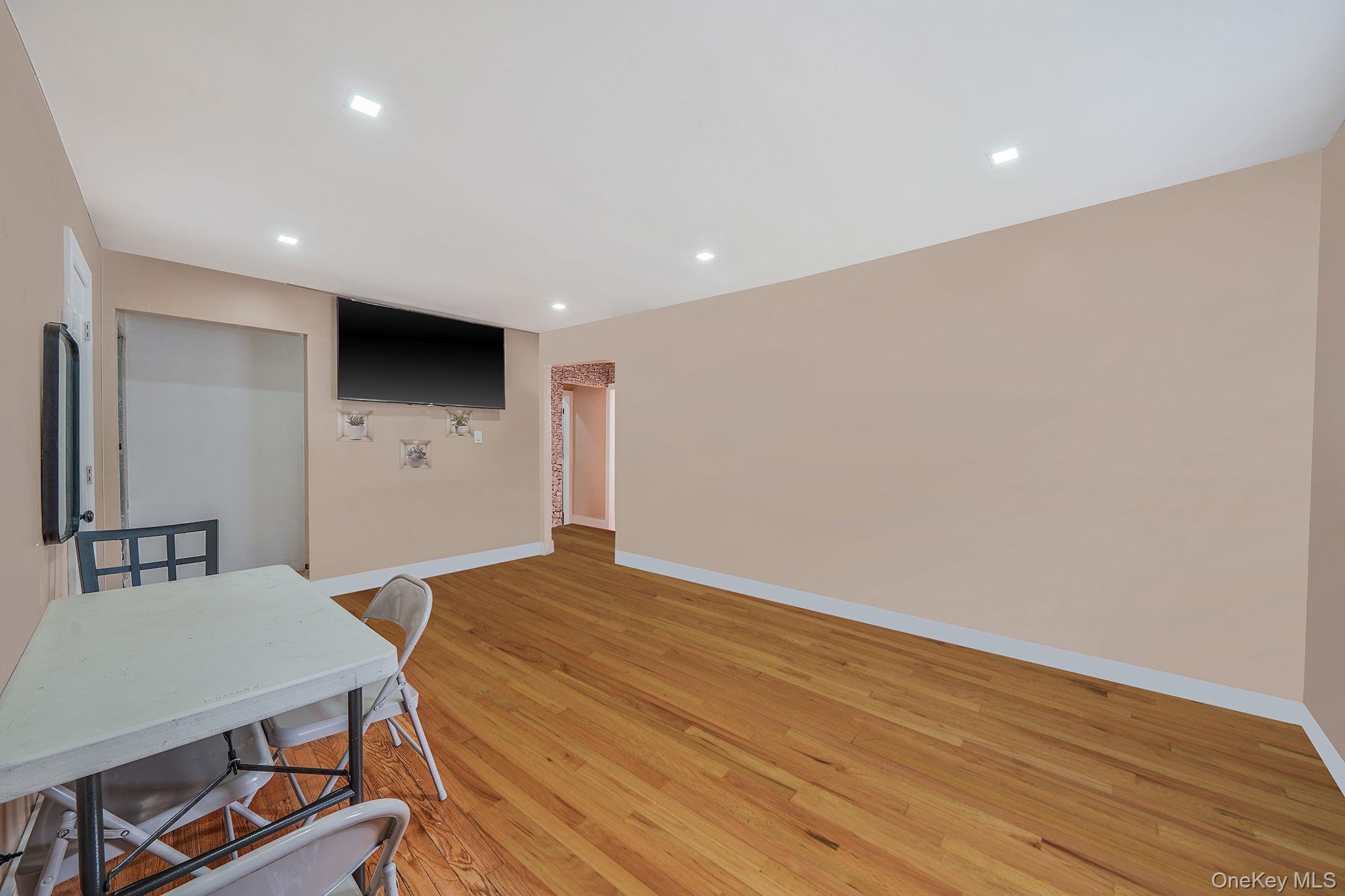 202-02 109th Avenue Queens, NY 11412 - Photo 8 of 26 Living room featuring light wood-style flooring and recessed lighting