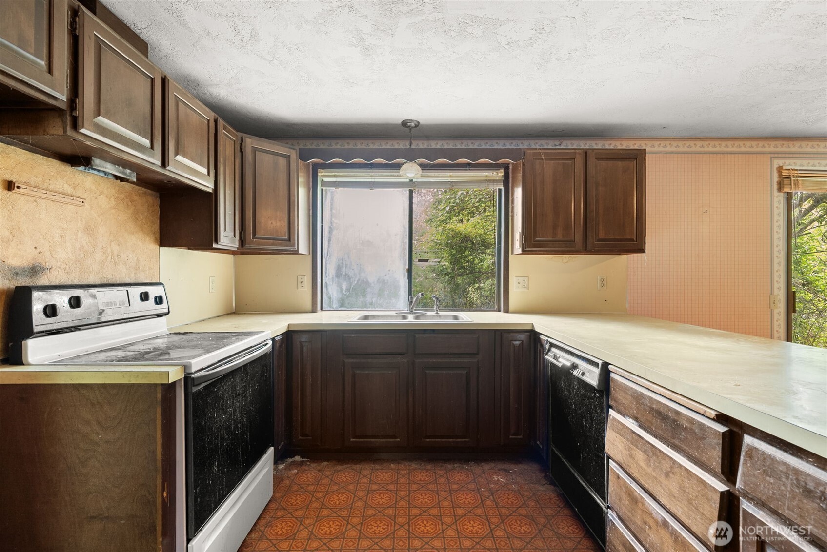 626 Ostman Road Raymond, WA 98577 - Photo 6 of 29 a kitchen with a sink and a window