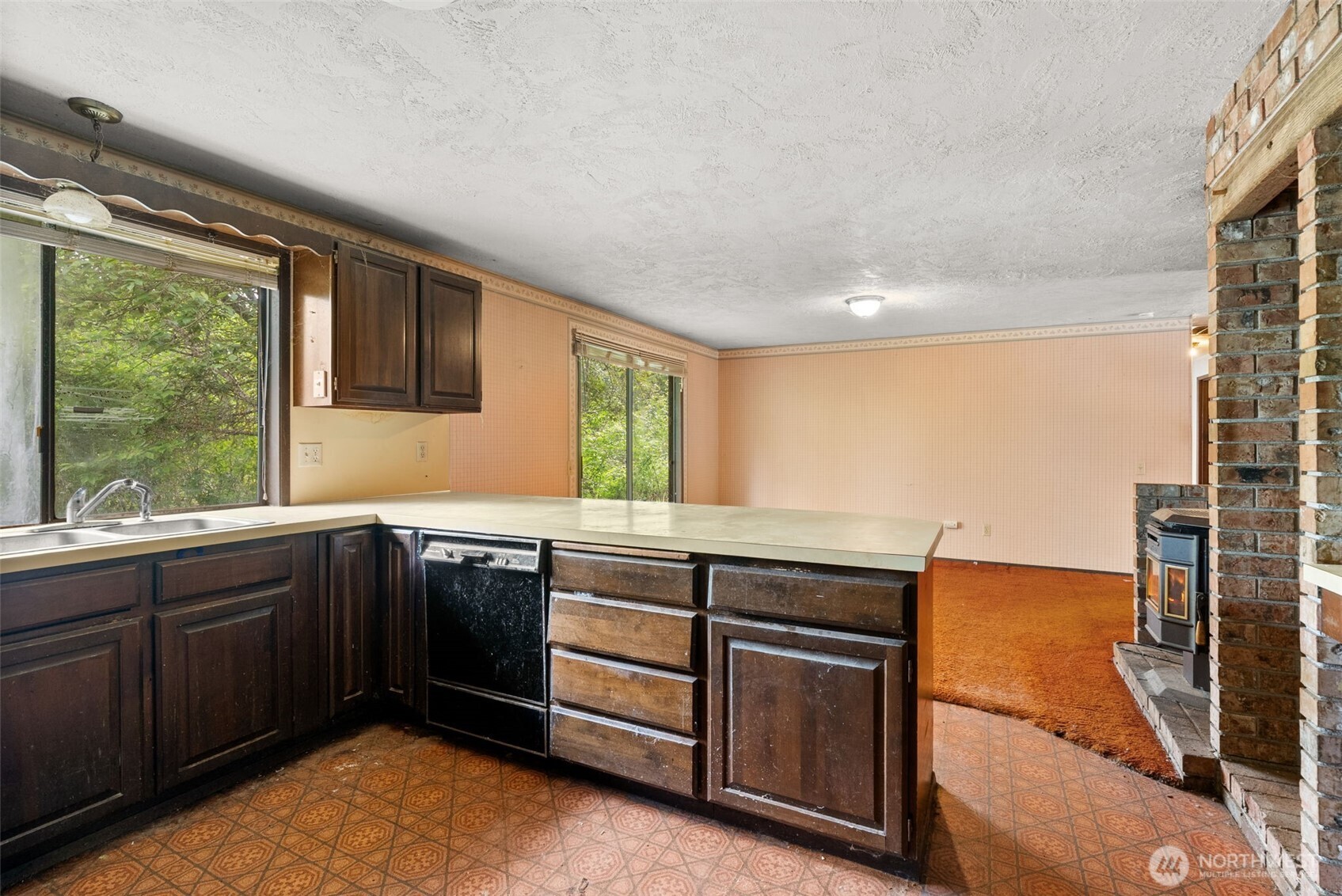 626 Ostman Road Raymond, WA 98577 - Photo 7 of 29 a kitchen with a sink stove and refrigerator