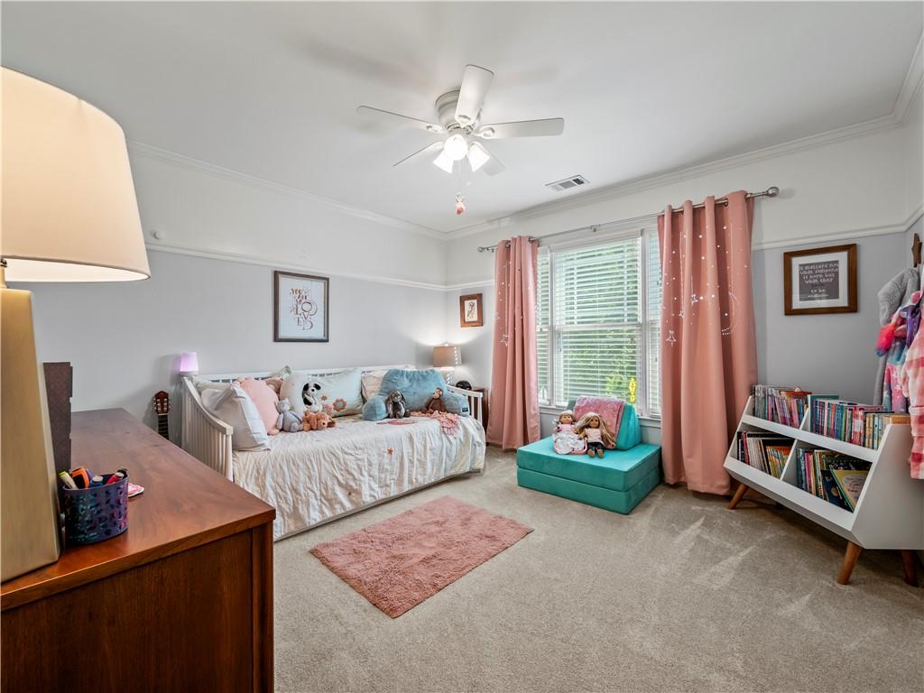 453 Hunter Street Northwest Norcross, GA 30071 - Photo 13 of 36 a bedroom with furniture and a bed