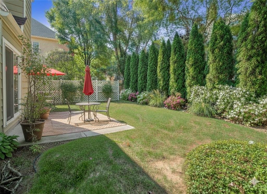 453 Hunter Street Northwest Norcross, GA 30071 - Photo 22 of 36 a view of a house with backyard and sitting area