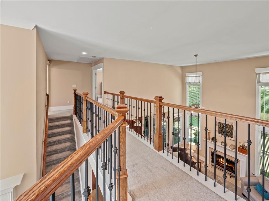 453 Hunter Street Northwest Norcross, GA 30071 - Photo 10 of 36 a view of staircase with lots of frames on wall and windows