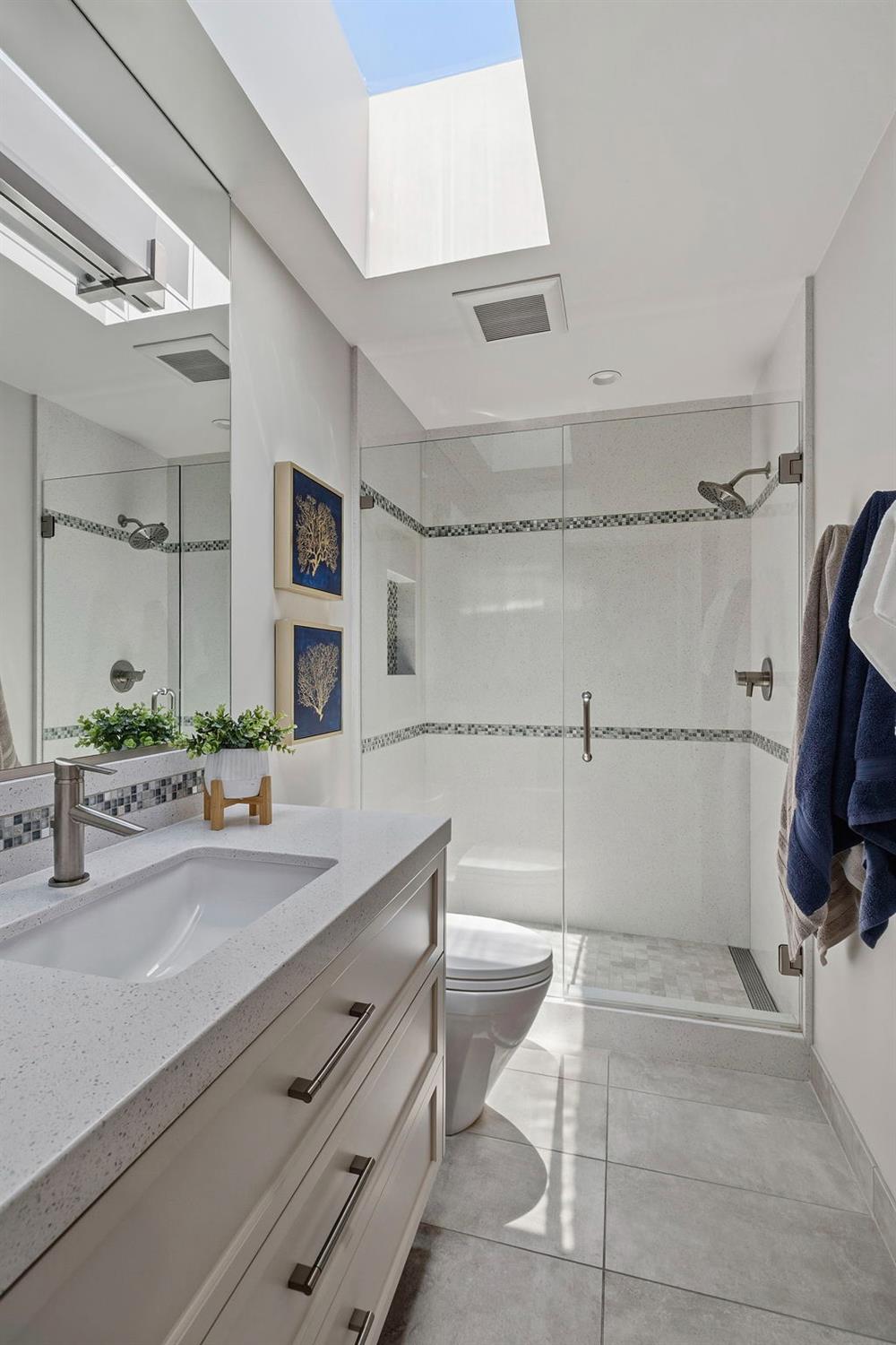 1013 Copper Lake Court Modesto, CA 95355 - Photo 16 of 66 a bathroom with a tub sink and mirror