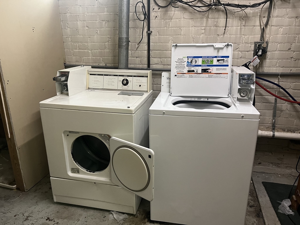 60 Parkman Street, Unit A1 Brookline, MA 02446 - Photo 5 of 6 a utility room with dryer and washer