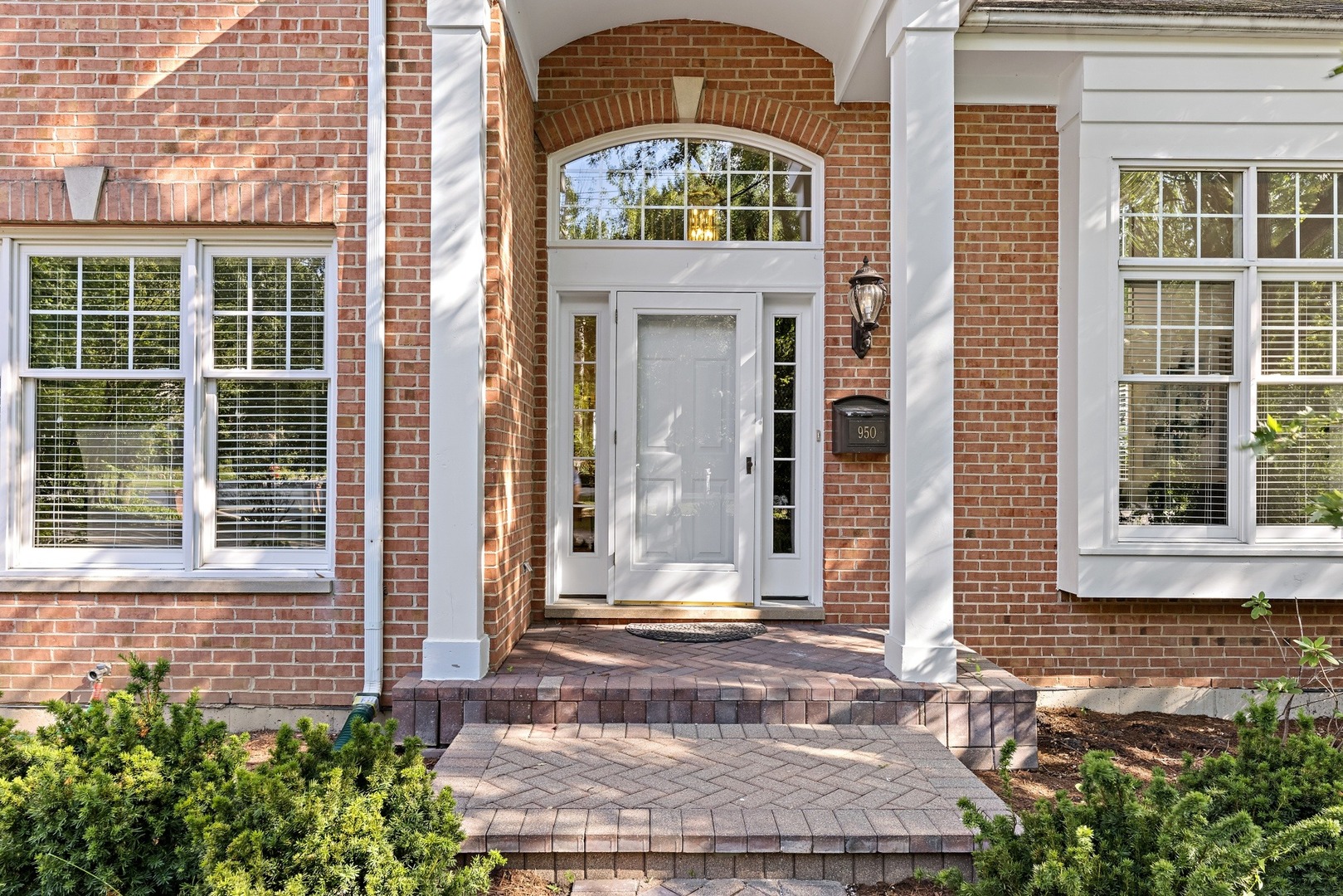 950 Shermer Road Northbrook, IL 60062 - Photo 2 of 32 a front view of a house with a yard