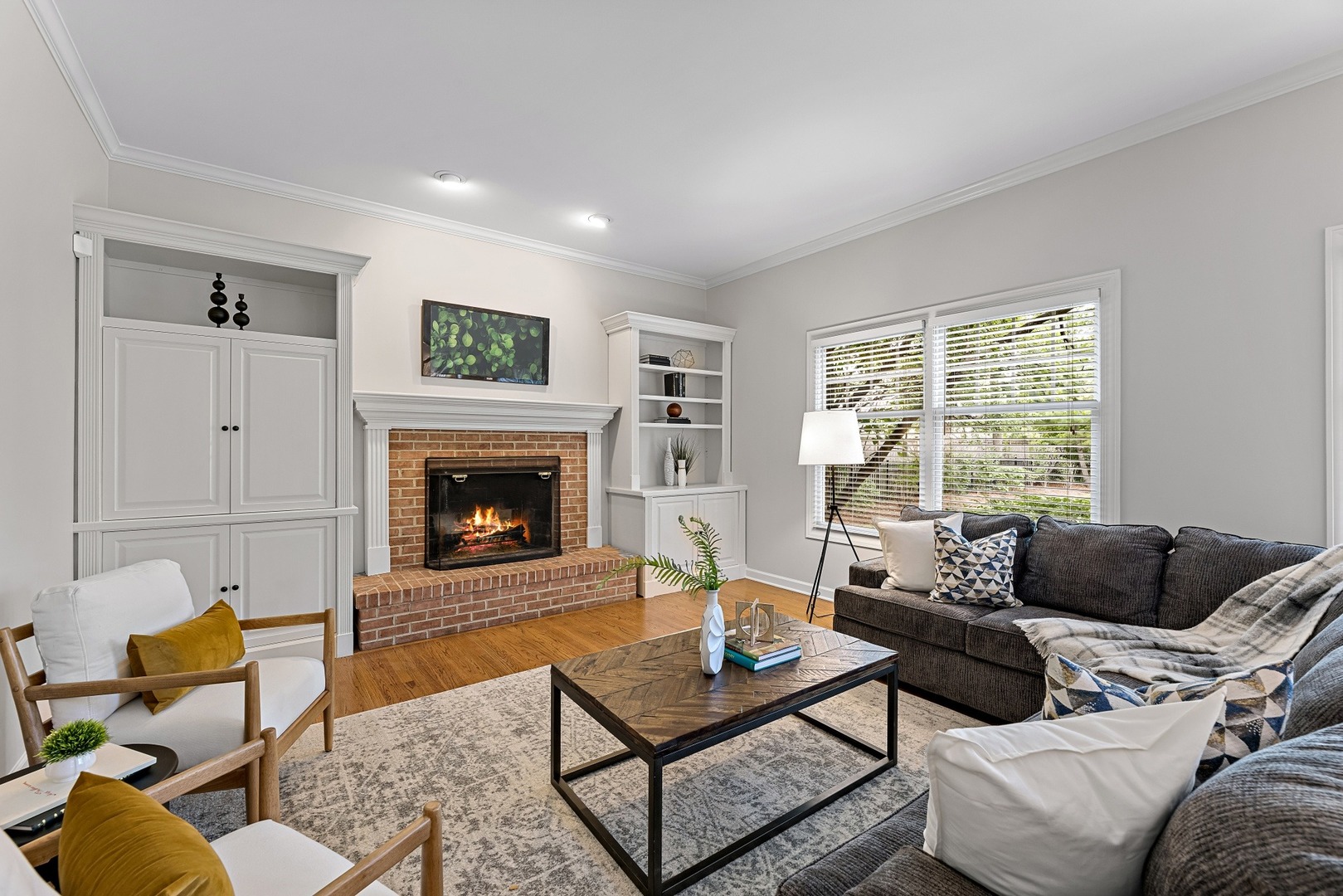 950 Shermer Road Northbrook, IL 60062 - Photo 12 of 32 a living room with furniture a rug and a fireplace
