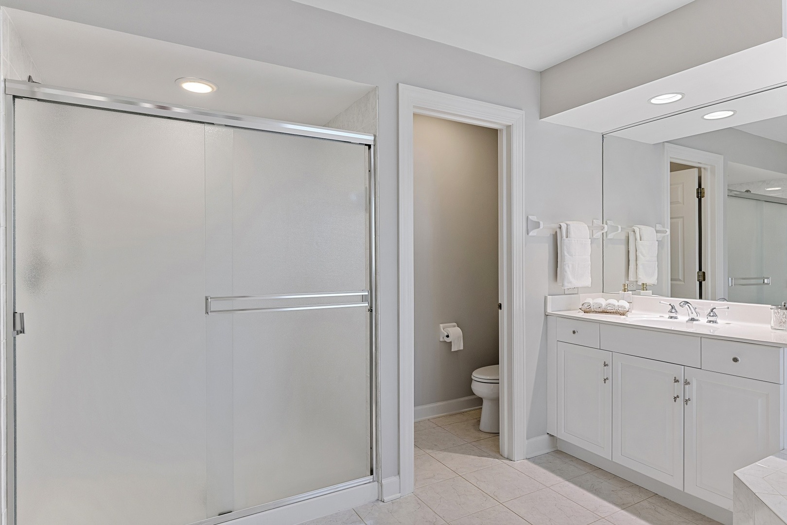 950 Shermer Road Northbrook, IL 60062 - Photo 18 of 32 a bathroom with a double vanity sink and a mirror