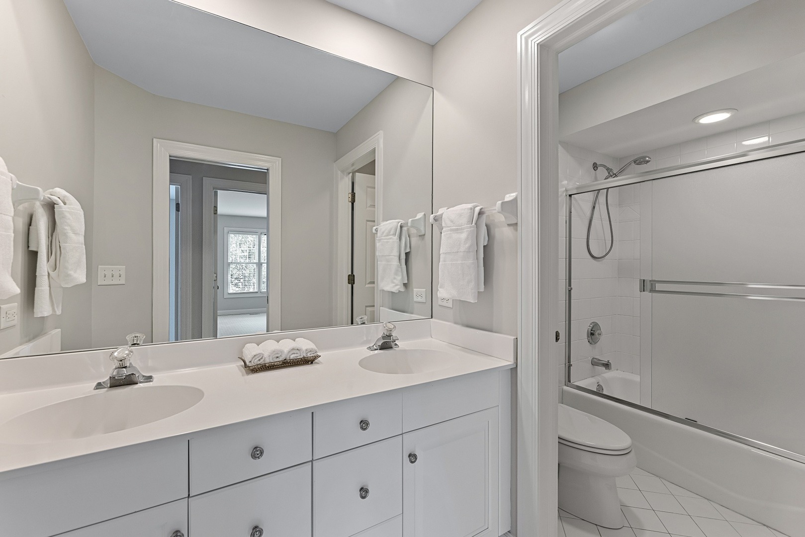 950 Shermer Road Northbrook, IL 60062 - Photo 20 of 32 a bathroom with a double vanity sink toilet mirror and shower