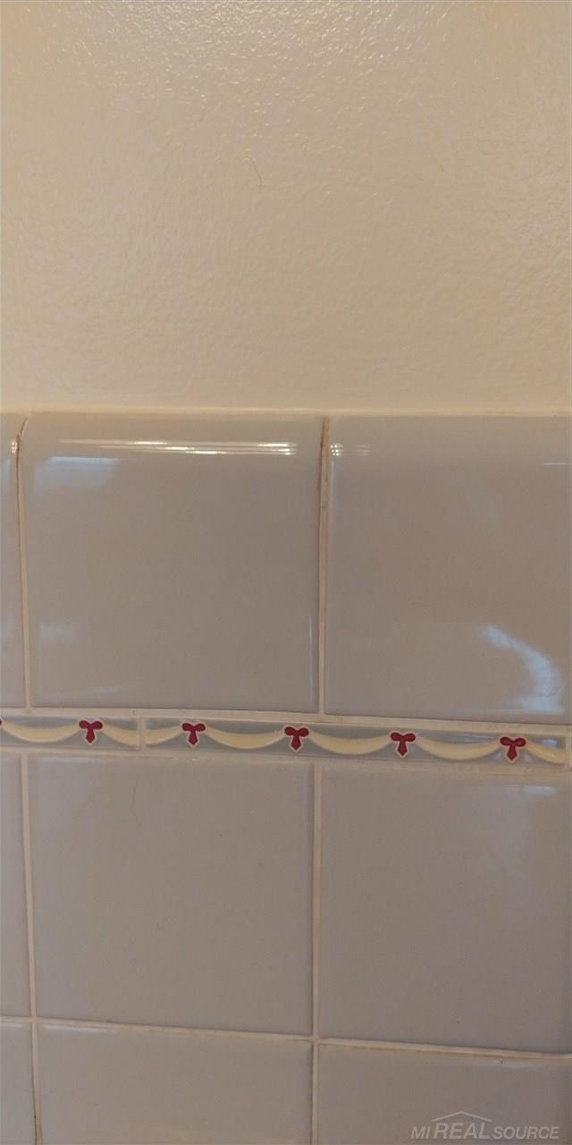 30521 Utica Road Roseville, MI 48066 - Photo 11 of 19 Notice the exquisite detailing of the bows and ribboning in the tile! Event the paint has been carefully selected to match and highlight these details!