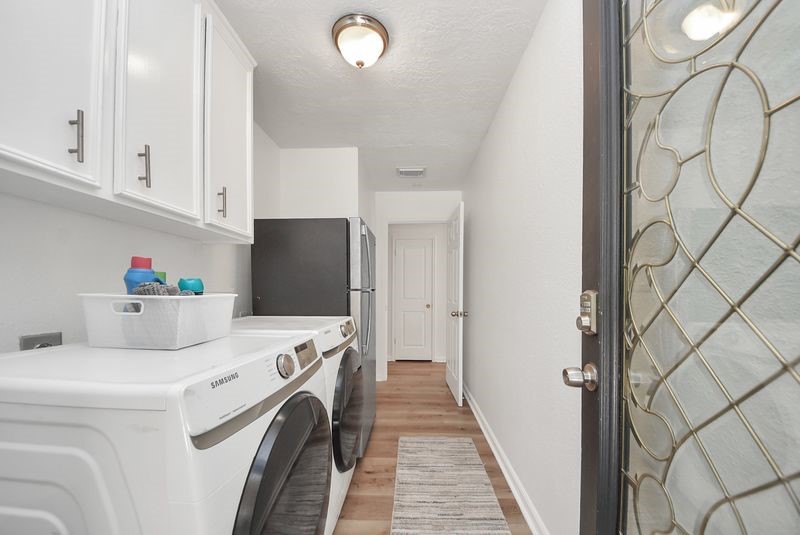 155 Springs Edge Drive Conroe, TX 77356 - Photo 21 of 49 a utility room with dryer and washer