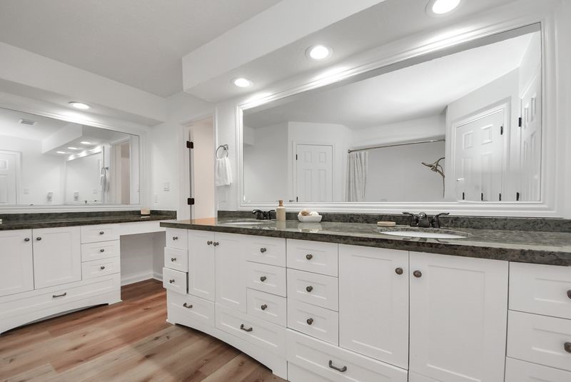 155 Springs Edge Drive Conroe, TX 77356 - Photo 25 of 49 a bathroom with granite countertop white cabinets and a sink