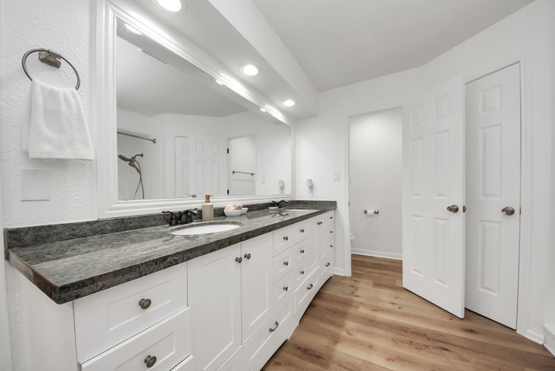 155 Springs Edge Drive Conroe, TX 77356 - Photo 26 of 49 a bathroom with a granite countertop sink and a mirror