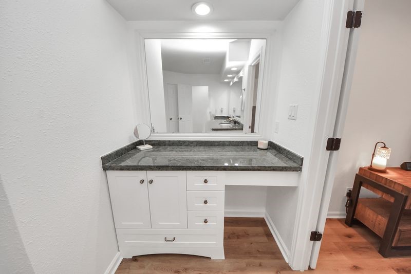 155 Springs Edge Drive Conroe, TX 77356 - Photo 27 of 49 a view of a sink and mirror in a room