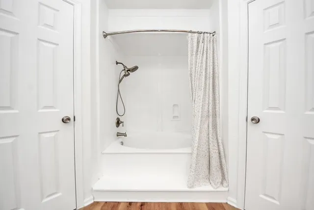 a bathroom with a glass shower door