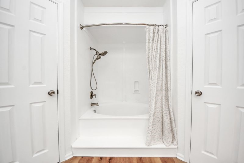 155 Springs Edge Drive Conroe, TX 77356 - Photo 28 of 49 a bathroom with a glass shower door