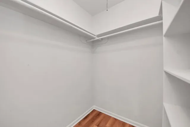 a view of a room with shelf on the wall