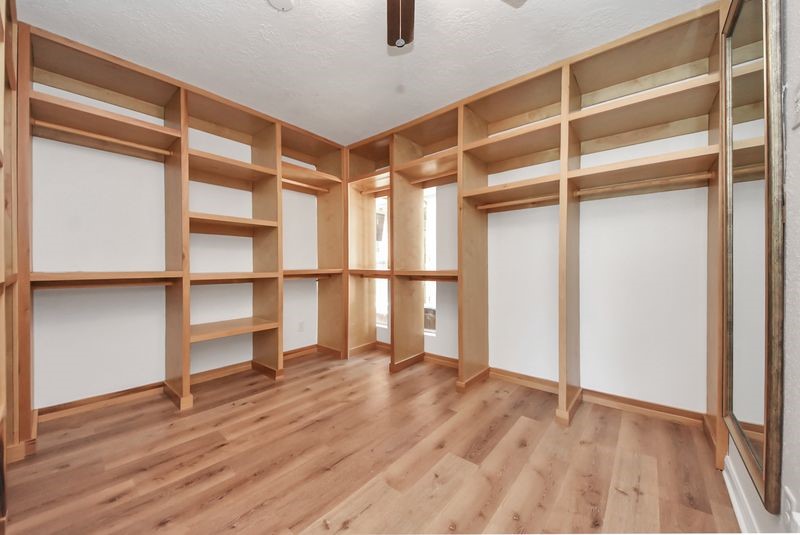 155 Springs Edge Drive Conroe, TX 77356 - Photo 31 of 49 a view of an empty room with wooden floor and a window