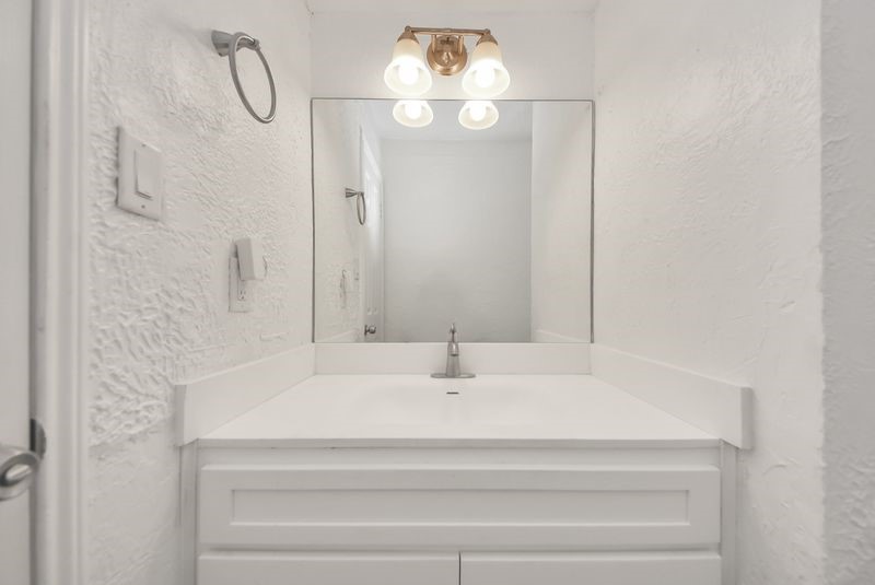 155 Springs Edge Drive Conroe, TX 77356 - Photo 36 of 49 a bathroom with a sink and mirror