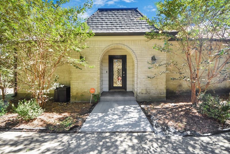 155 Springs Edge Drive Conroe, TX 77356 - Photo 6 of 49 a view of a brick house with many windows