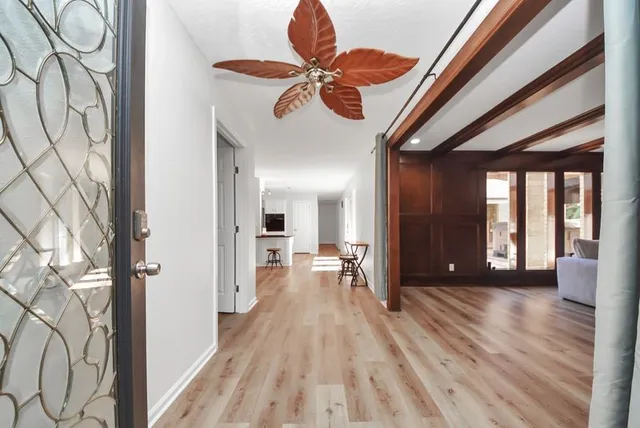 a view of an entryway with wooden floor