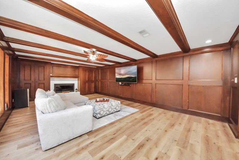 155 Springs Edge Drive Conroe, TX 77356 - Photo 10 of 49 a living room with furniture and a fireplace