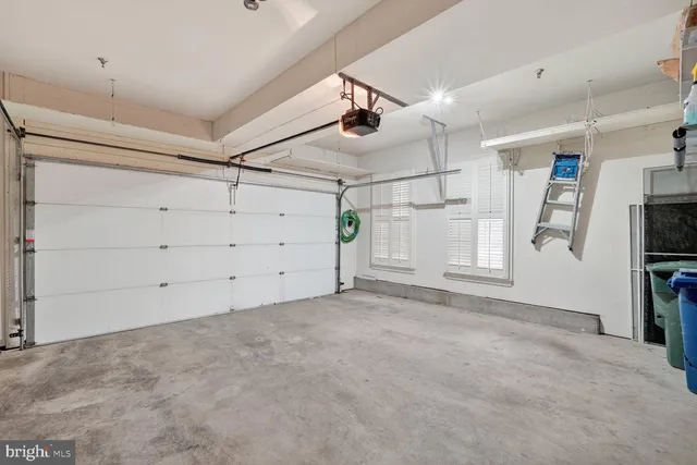 a picture of a room with furniture and air hockey table