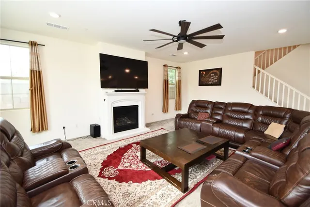 a kitchen with stainless steel appliances kitchen island granite countertop a table and chairs in it