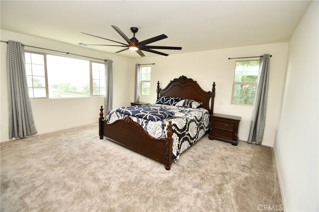 5367 Heitz Way Fontana, CA 92336 - Photo 24 of 50 a bedroom with a bed and a window