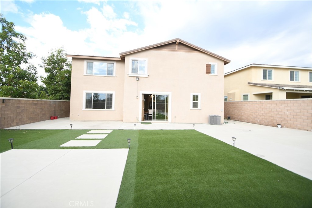 5367 Heitz Way Fontana, CA 92336 - Photo 35 of 50 a view of a house with a yard and garage