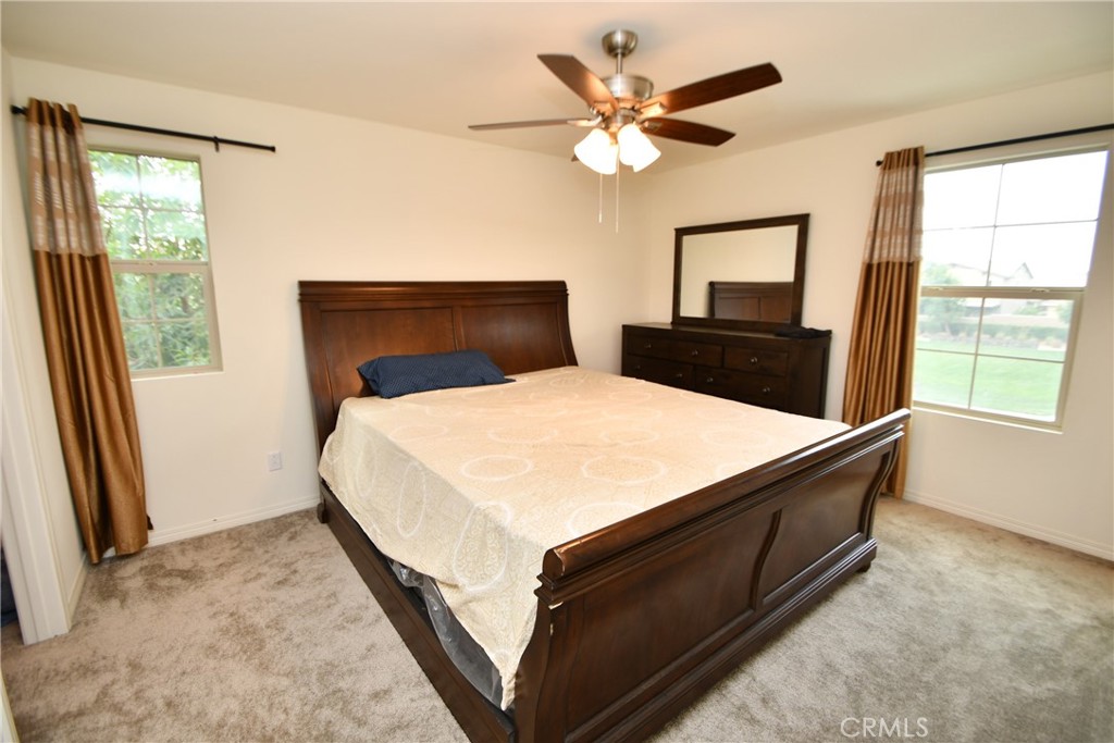 5367 Heitz Way Fontana, CA 92336 - Photo 38 of 50 a bedroom with a bed and a window