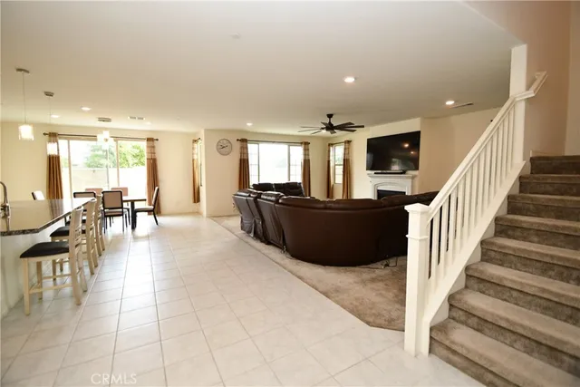a view of a living room and a livingroom with furniture stairs