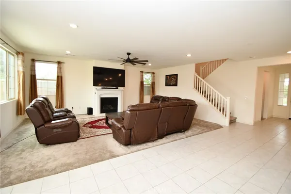 a view of a dining room with furniture and a window