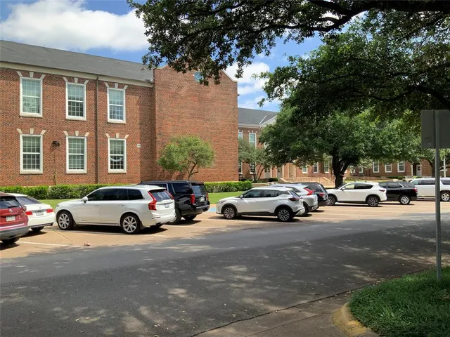 a car parked in front of a houses