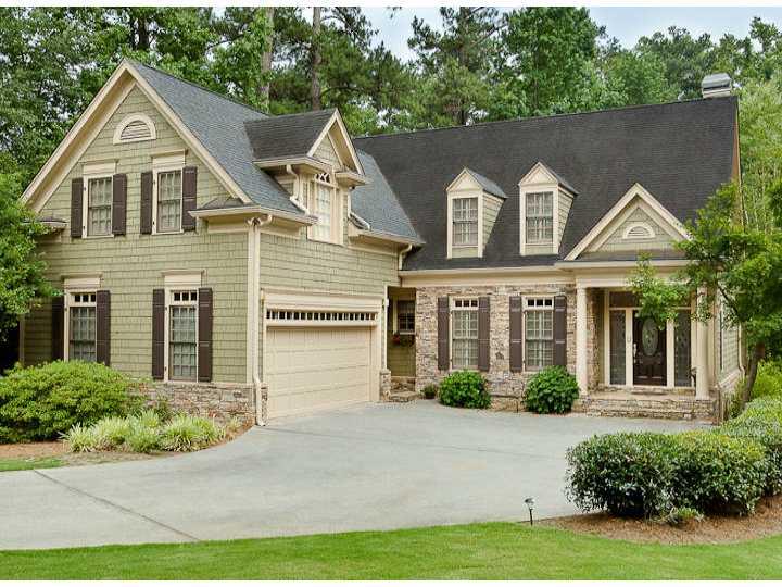 Exterior Front. This beautiful shingle and stone home is welcoming and comfortable while exuding gracious charm.