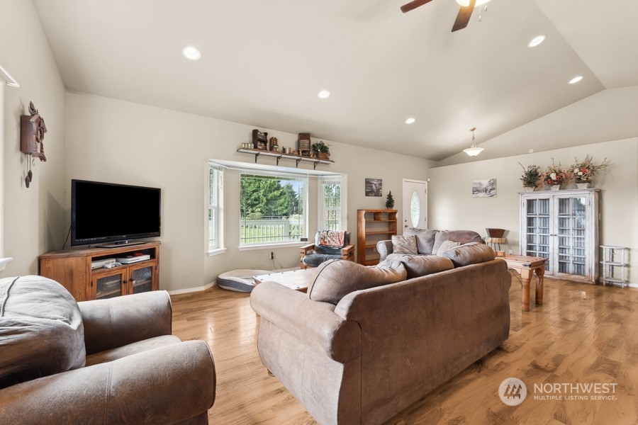 9422 Gastaeson Lane Southwest Rochester, WA 98579 - Photo 15 of 35 a living room with furniture and a flat screen tv