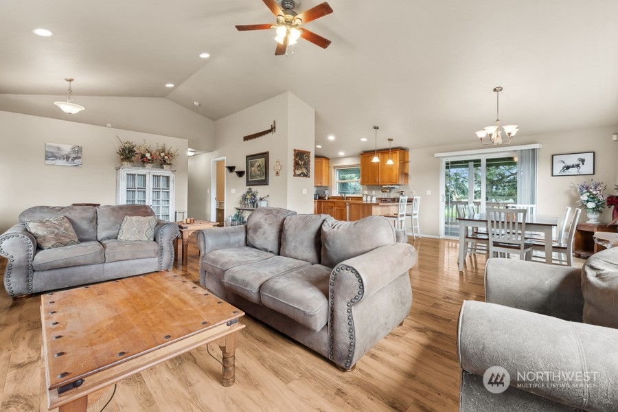 9422 Gastaeson Lane Southwest Rochester, WA 98579 - Photo 16 of 35 a living room with furniture and a chandelier