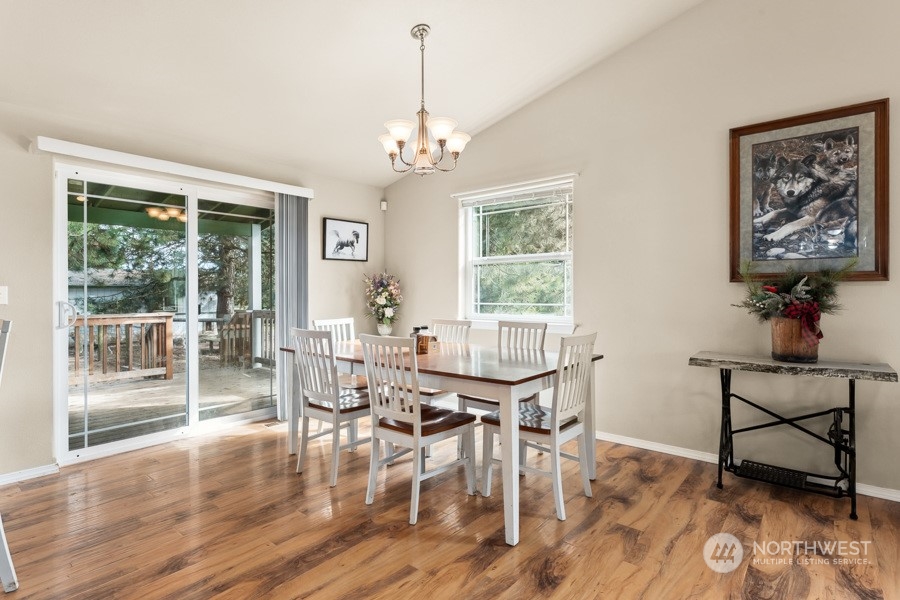 9422 Gastaeson Lane Southwest Rochester, WA 98579 - Photo 17 of 35 a view of a dining room with furniture window and wooden floor