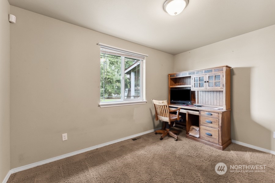 9422 Gastaeson Lane Southwest Rochester, WA 98579 - Photo 24 of 35 a view of a workspace with furniture and a window