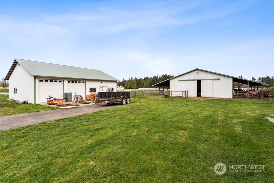 9422 Gastaeson Lane Southwest Rochester, WA 98579 - Photo 5 of 35 a view of a house with a yard