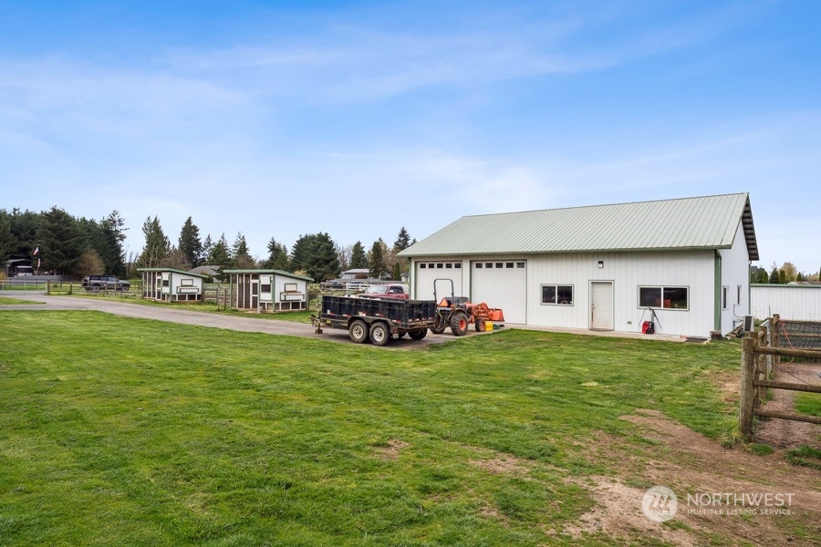 9422 Gastaeson Lane Southwest Rochester, WA 98579 - Photo 7 of 35 a view of a house with a big yard and large trees
