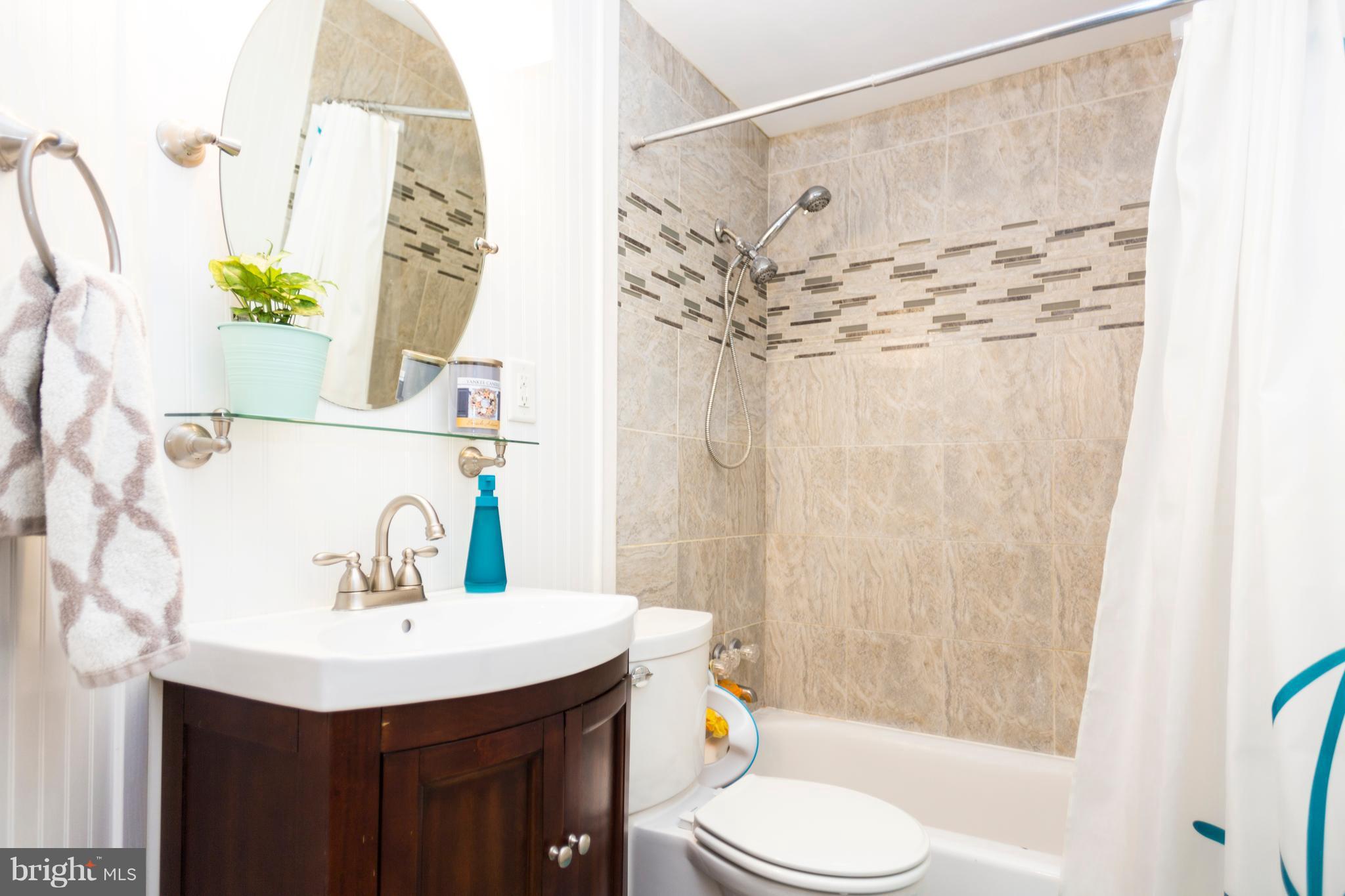2703 Yarnall Road Halethorpe, MD 21227 - Photo 12 of 28 a bathroom with a sink and a mirror