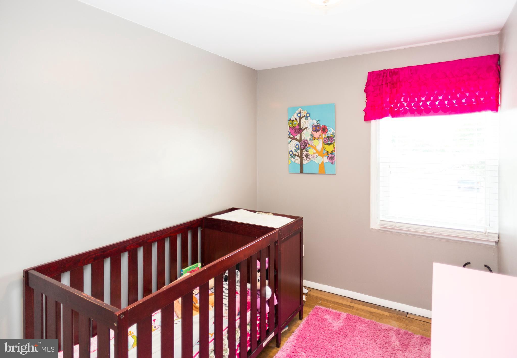 2703 Yarnall Road Halethorpe, MD 21227 - Photo 13 of 28 a bedroom with a bed and a window