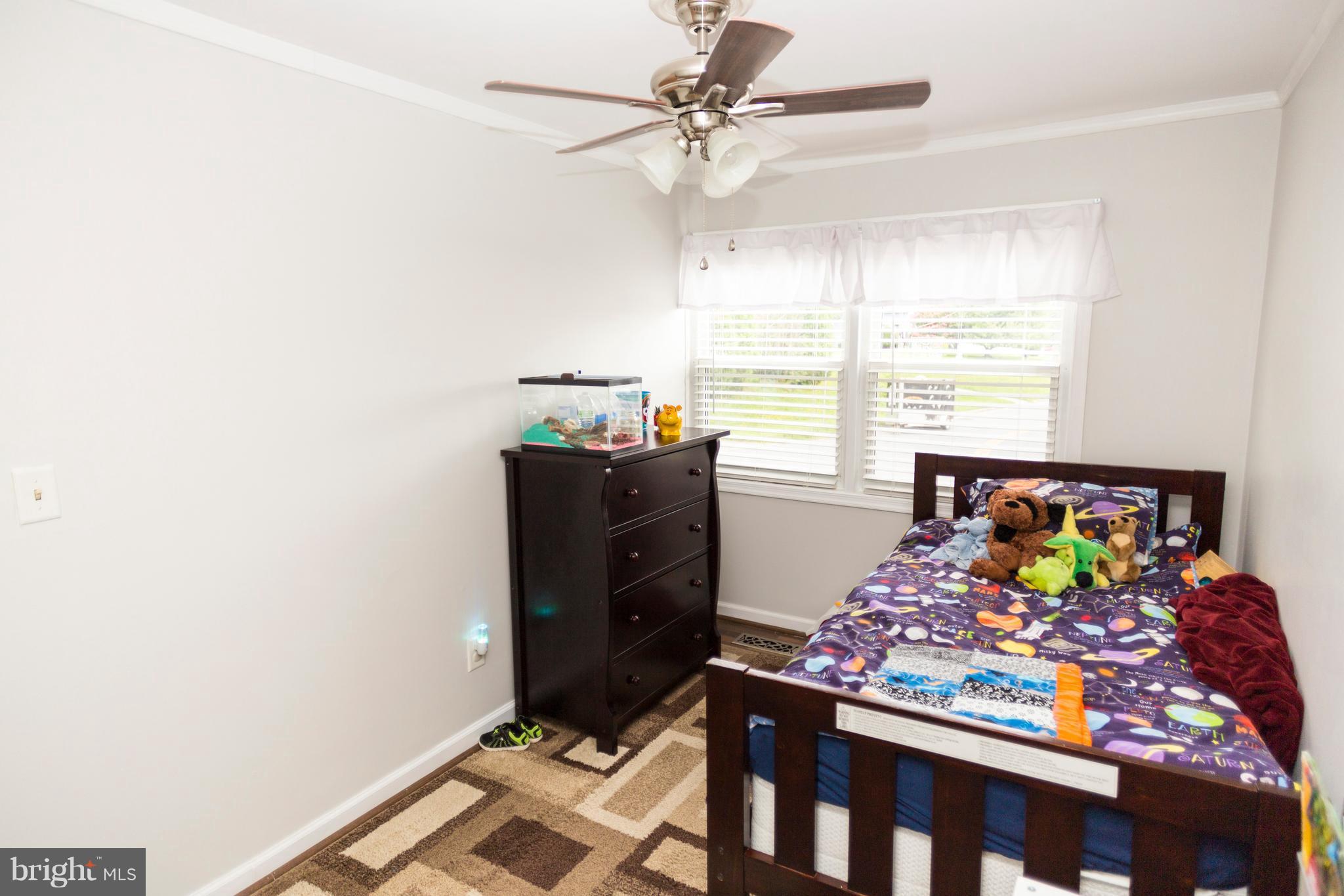 2703 Yarnall Road Halethorpe, MD 21227 - Photo 16 of 28 a living room with furniture and a baby crib